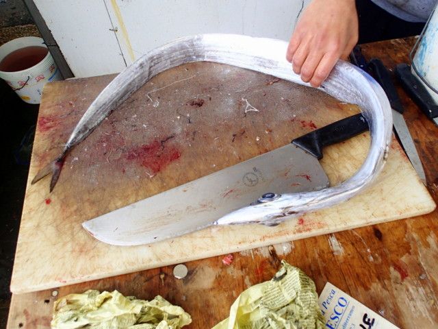 Cutting the fish in the Trapani Fish Market in Old Town Trapani